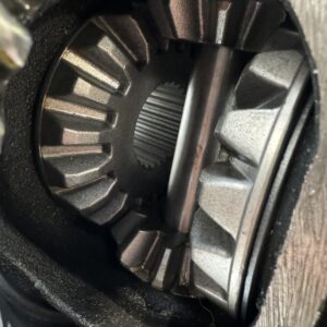 Close-up view of metal gears and components inside Import placeholder for 2081, highlighting intricate teeth and grooves in the mechanical system.