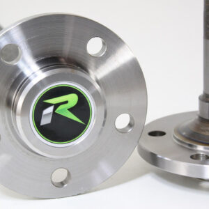 Close-up of two metal axles with flanges from Import placeholder for 2224, one featuring a green and black "R" logo at the centre and four bolt holes, shown against a plain white background.