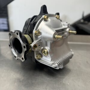 A close-up of a clean, newly assembled Nissan GT-R (BNR32) Rear Diff 4.11 Ratio with Cusco 1.5 Way LSD shows its metallic casing, bolts, and flanges resting on a stainless steel surface.