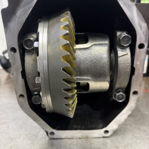 Close-up of the Mazda Rx7 FD 4.3 Mazdaspeed 2 way Rebuilt Rear Diff, highlighting its exposed gear assembly with detailed teeth coated in yellow marking compound to check the mesh pattern inside the metal housing.