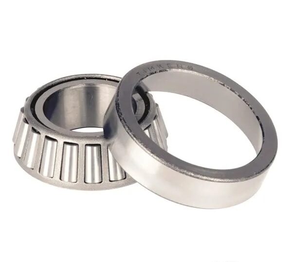 A metal tapered roller bearing and its matching outer ring, both silver in colour, are positioned closely together on a plain white background.