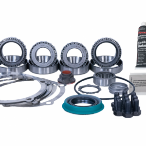 A Ford 9 Inch Rear Axle 31 Spline Ring and Pinion Master Fitting Kit by Revolution Gear, featuring bearings, gaskets, bolts, a tube of gasket sealant, and seals, all arranged on a white background.